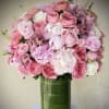 A luxurious, romantic arrangement built around lush pink roses and peonies-perfect as