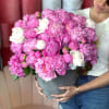  100 PEONIES IN A VASE.
