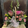This basket features shades of pink with subtle accents of white, nicely
