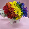 Rainbow flower arrangement in a unicorn-shaped ceramic container