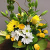 This modern design with blooms in greens, white and yellow is a