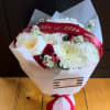 A bold celebration bouquet designed for the Class of 2026. Featuring rich