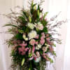 Tall floral standing spray with pink and white blooms