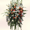 A tall standing spray designed to make a dignified statement, this flower