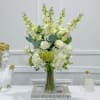 Classic and graceful, this white arrangement symbolizes new beginnings sincerity,and pure love