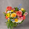 Like a garden brought to life by an artist's brush, this arrangement