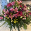 Mix floral arrangement with FAN in between flowers. 