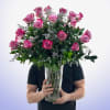A lush cascade of vivid magenta roses creates an unforgettable romantic statement