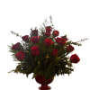 Roses and eucalyptus in an arrangement pot 
