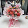 Pinks, red, white, and purple roses with playful accents, a graduation topper