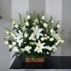 A peaceful arrangement symbolizing purity,love and eternal rest an elegant tribute for