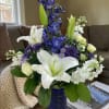 River Breeze is fresh, cool, and effortlessly elegant. Graceful white lilies and