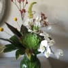Bouquet with phalaenopsis orchids and succulent accents.