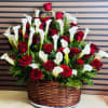 Calla Lillies and Red Roses in a Brown Basket 
