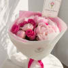 A romantic bouquet of soft pink peonies and premium hot pink roses