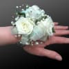 White rose wrist corsage with baby's breath and silver ribbon