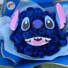 Vivid blue roses shaped into a playful character bouquet with pink