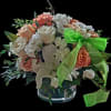 "A warm burst of fresh, natural light. This lovely low-vase arrangement beautifully