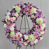 This Standing Wreath Includes Stargazer Lilies, Lavender Roses, White Roses, White Gerbera