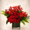 A bold luxury floral arrangement featuring premium red roses paired with vibrant