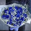 Bouquet of blue roses with white baby's breath in clear wrap