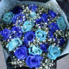 Bouquet of blue and purple roses with white baby's breath