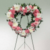 Large heart-shaped wreath of pink roses, carnations, white mums and daisies