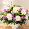 Soft pink roses nestled among cloud-like white hydrangeas make this pink and