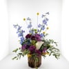 Tall blue delphinium-like spikes paired with purple daisy-style blooms make this Fresh