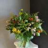 One dozen beautiful alstromeria designed in vase. Color and filler with be