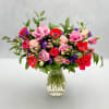 This colorful, front facing arrangement was created by our own "Emily in