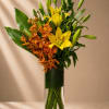 Bold, radiant, and luxuriously tropical, Golden Ember is a striking vertical arrangement