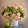 A softly romantic centerpiece that makes someone feel delightfully cherished - Rosa