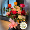 This vibrant garden-style vase arrangement is a joyful mix of bold color