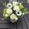 This Divine mix created of crisp White Anemone, White Roses, White Tulips