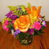The Bountiful Brights Bouquet showcases an array of vibrant, fresh-cut flowers arranged