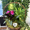 Bright pink blooms and elegant white calla lilies are arranged in a