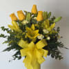 A beautiful assortment of fresh blooms beautifully designed in a yellow contrast