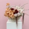 Where peach whispers meet blush and burgundy dreams , a basket full
