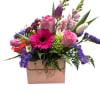 Mixed bouquet in a pink box with roses, tulips, and gerbera daisies
