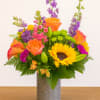 The Blissfully Bold Bouquet features a striking combination of vibrant, premium fresh-cut