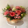 Bright mx of flowers in a basket. Garden rose, Chrysanthemum, Solidago, Hydrangea.