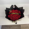 Bouquet of red roses wrapped in black paper with an 