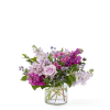 A soft, elegant mix of lavender roses, magenta stock, white hydrangeas, and