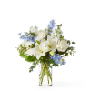 An elegant blend of white lilies, roses, and chrysanthemums accented with soft