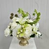 This Gold Pedestal Dish Arrangement Includes White Roses, White Spray Roses, White