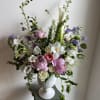 The Madeline is a soft and romantic garden-style floral arrangement designed to