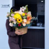 A burst of sunlit color-this large mixed-color flower arrangement makes an immediate