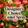 A lush, designer-selected casket spray  that honors a life with warmth
