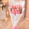12 Light Pink Roses Wrapped in Paper with a Decorative Bow